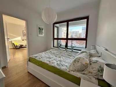 Łóżko lub łóżka w pokoju w obiekcie Apartament Branickiego 11