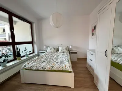 Łóżko lub łóżka w pokoju w obiekcie Apartament Branickiego 11