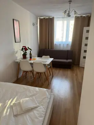 Łóżko lub łóżka w pokoju w obiekcie Czerniakowska 42