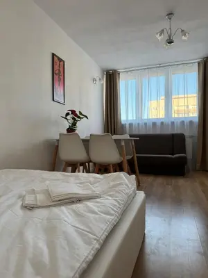 Łóżko lub łóżka w pokoju w obiekcie Czerniakowska 42