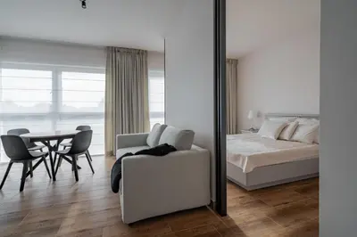 Łóżko lub łóżka w pokoju w obiekcie Apartamenty Szelągowskiej