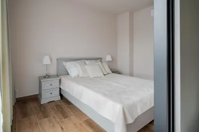 Łóżko lub łóżka w pokoju w obiekcie Apartamenty Szelągowskiej