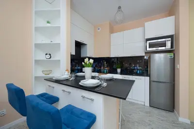 Kuchnia lub aneks kuchenny w obiekcie Bright Apartment Przyokopowa in the Centre of Warsaw with Parking by Noclegi Renters