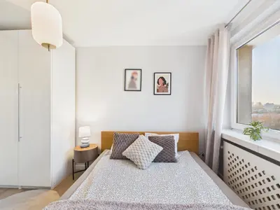 Łóżko lub łóżka w pokoju w obiekcie Zwycięzców 4A SuperApart near National Stadion