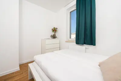 Łóżko lub łóżka w pokoju w obiekcie ShortStayPoland Daniszewska B192