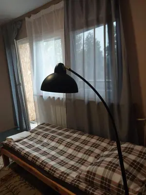 Łóżko lub łóżka w pokoju w obiekcie WKL Dom gościnny