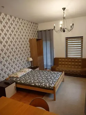 Łóżko lub łóżka w pokoju w obiekcie WKL Dom gościnny