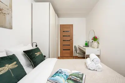 Łóżko lub łóżka w pokoju w obiekcie Lumina stylish 2-room apartment in Warsaw