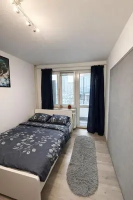 Łóżko lub łóżka w pokoju w obiekcie Chmielna Residence