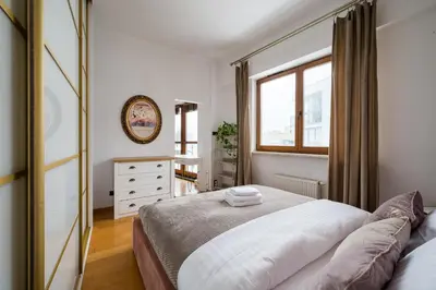 Łóżko lub łóżka w pokoju w obiekcie Wilanów Urban Chic Apartment by BookingHost