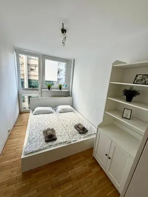 Łóżko lub łóżka w pokoju w obiekcie Warsaw Prime Apartment