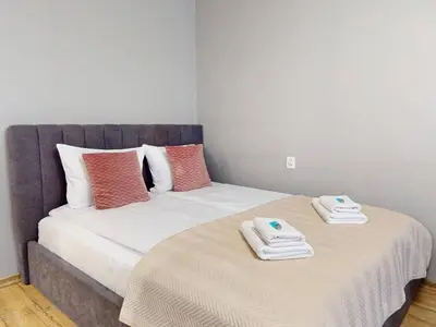 Łóżko lub łóżka w pokoju w obiekcie Magnolia Studio Deluxe City Center Anielewicza
