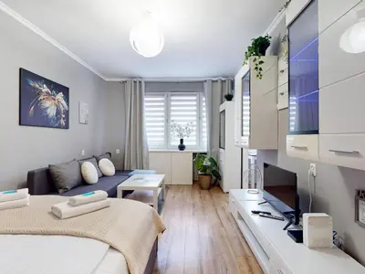 Łóżko lub łóżka w pokoju w obiekcie Magnolia Studio Deluxe City Center Anielewicza