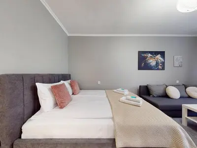 Łóżko lub łóżka w pokoju w obiekcie Magnolia Studio Deluxe City Center Anielewicza