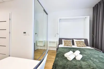 Łóżko lub łóżka w pokoju w obiekcie Kasprzaka 31 By PerfectApart 925
