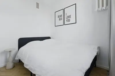 Łóżko lub łóżka w pokoju w obiekcie Apartament Saska Kępa