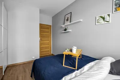 Łóżko lub łóżka w pokoju w obiekcie Bemowo Two-Bedrooms Apt - 52m2, Parking, Loggia - by Rentujemy