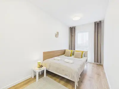 Łóżko lub łóżka w pokoju w obiekcie Kierbedzia 4 SuperApart near to Olinek