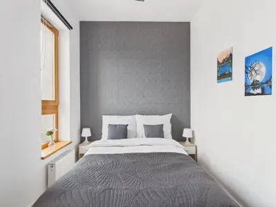 Łóżko lub łóżka w pokoju w obiekcie Popularna 38 Comfort Suite Warsaw by Solarento