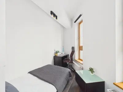 Łóżko lub łóżka w pokoju w obiekcie Popularna 38 Comfort Suite Warsaw by Solarento