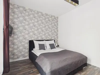 Łóżko lub łóżka w pokoju w obiekcie Popularna 38 Comfort Suite Warsaw by Solarento