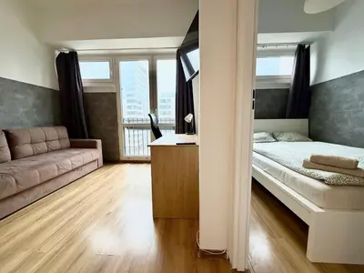 Łóżko lub łóżka w pokoju w obiekcie Flat next to Rondo ONZ