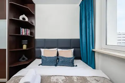 Łóżko lub łóżka w pokoju w obiekcie Lumina 3-rooms apartment with parking