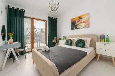 Łóżko lub łóżka w pokoju w obiekcie Lumina premium family apartment patio with private garden