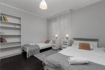 Łóżko lub łóżka w pokoju w obiekcie Aleja Jana Pawła II 80 Parking Free by Homeprime