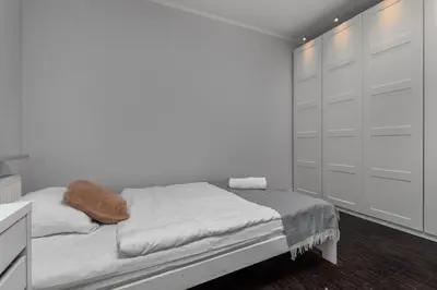 Łóżko lub łóżka w pokoju w obiekcie Aleja Jana Pawła II 80 Parking Free by Homeprime