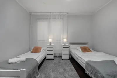 Łóżko lub łóżka w pokoju w obiekcie Aleja Jana Pawła II 80 Parking Free by Homeprime