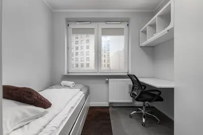 Łóżko lub łóżka w pokoju w obiekcie Aleja Jana Pawła II 80 Parking Free by Homeprime