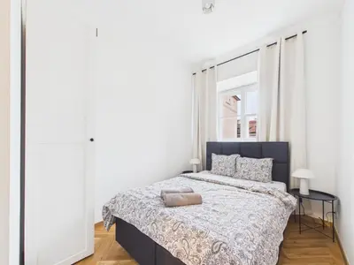Łóżko lub łóżka w pokoju w obiekcie Warsaw Premium Apartments Mariensztat