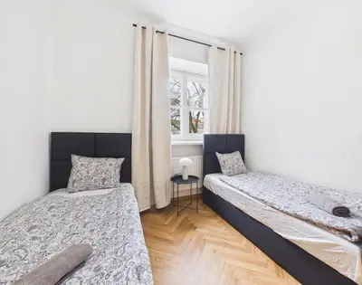 Łóżko lub łóżka w pokoju w obiekcie Warsaw Premium Apartments Mariensztat