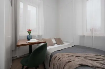 Łóżko lub łóżka w pokoju w obiekcie Functional Pet-Friendly Micro-Apartment in Warsaw by Noclegi Renters