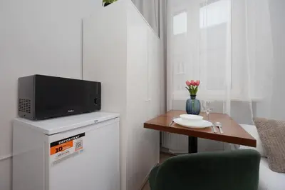 Telewizja i/lub zestaw kina domowego w obiekcie Functional Pet-Friendly Micro-Apartment in Warsaw by Noclegi Renters