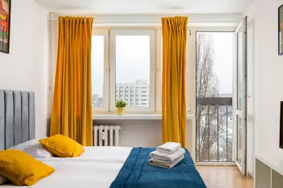 Łóżko lub łóżka w pokoju w obiekcie Broniewskiego Comfort Studio by BookingHost