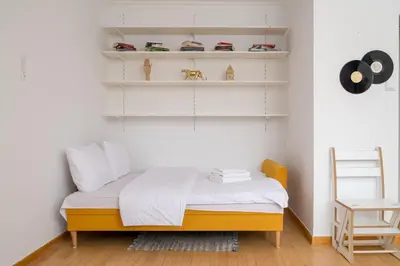 Łóżko lub łóżka w pokoju w obiekcie Mokotów Czarnomorska Homely Studio by BookingHost