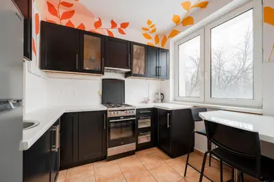 Kuchnia lub aneks kuchenny w obiekcie Mokotów Czarnomorska Homely Studio by BookingHost