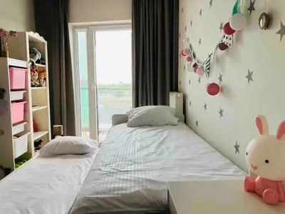 Łóżko lub łóżka w pokoju w obiekcie Family Jazz Apartment