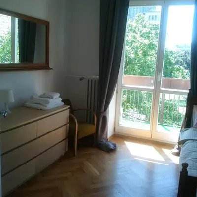 Łóżko lub łóżka w pokoju w obiekcie Center Apartment