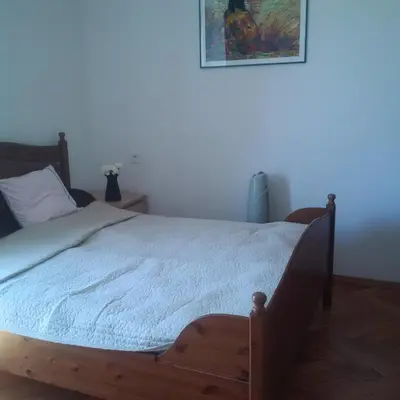 Łóżko lub łóżka w pokoju w obiekcie Center Apartment