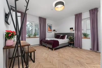 Łóżko lub łóżka w pokoju w obiekcie AURA 77 Żoliborz