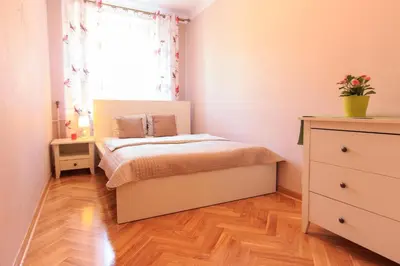 Łóżko lub łóżka w pokoju w obiekcie Rental Apartments Szeroki Dunaj