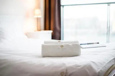 Łóżko lub łóżka w pokoju w obiekcie Warsaw Aparthotel