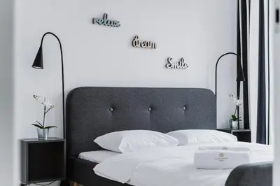 Łóżko lub łóżka w pokoju w obiekcie Warsaw Aparthotel