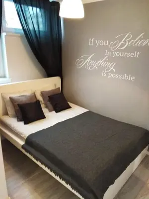 Łóżko lub łóżka w pokoju w obiekcie Apartment Oscar