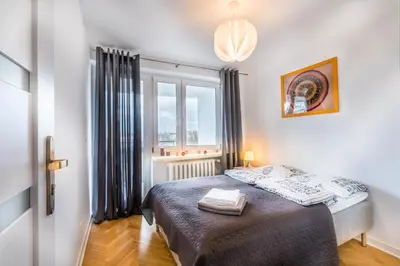 Łóżko lub łóżka w pokoju w obiekcie Center Warsaw- Apartamenty Smolna