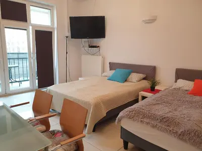 Łóżko lub łóżka w pokoju w obiekcie Center Warsaw- Apartamenty Smolna
