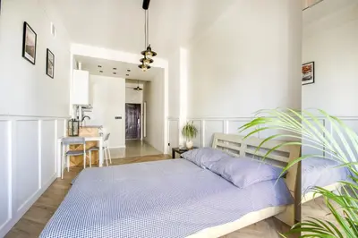 Łóżko lub łóżka w pokoju w obiekcie Studio Marszałkowska